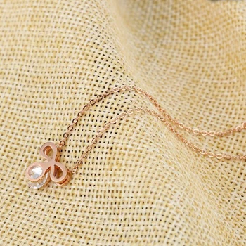Rose gold цвят на неръждаема стомана бижута лък монокристален Циркон огърлица за жени